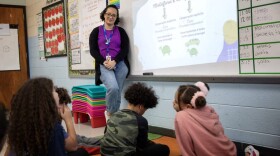 Bilingual teacher Juliana Santos listens to a student in her classroom at Potter Road Elementary School, Framingham.