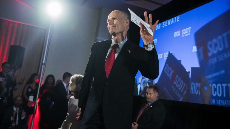 Republican Rick Scott, now a U.S. senator from Florida, takes the stage at his election night party in 2018. Days later, as his margin of victory tightened due to mail votes still being processed, he accused Democrats of trying to "steal" the election without providing evidence.