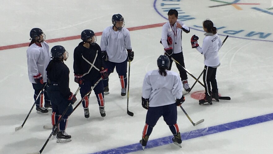 During a practice ahead of their first match in the Pyeongchang Winter Olympics, the unified Korean team wore blue and white jerseys — leaving onlookers to wonder which players were from the north.