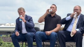 From left, Nebraska Gov. Jim Pillen, Dari Processing co-owner and CEO TJ Tuls and Seward Mayor Josh Eickmeier sample cold milk at a groundbreaking ceremony for a new dairy plant on Wednesday, June 18, 2025, in Seward, Neb.