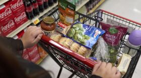 Jaqueline Benitez, who depends on SNAP benefits to help pay for food, shops for groceries at a supermarket.