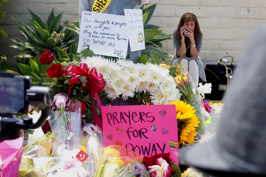 A memorial sits across the street from the Chabad of Poway Synagogue. On Saturday, one person was killed and three others injured when a gunman entered the building and fired his weapon.