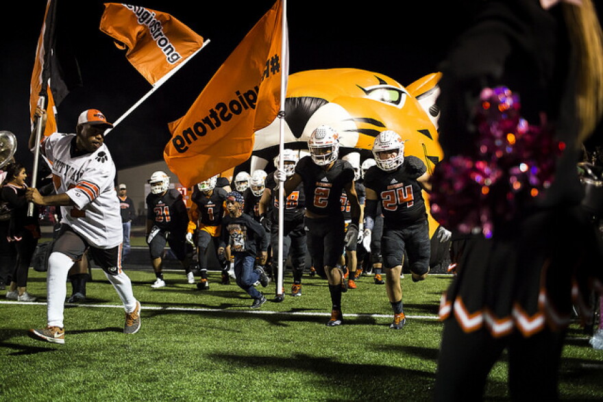 The Bobcats take the field for their homecoming game.
