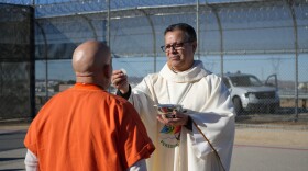 San Bernardino Diocese Bishop Alberto Rojas providing