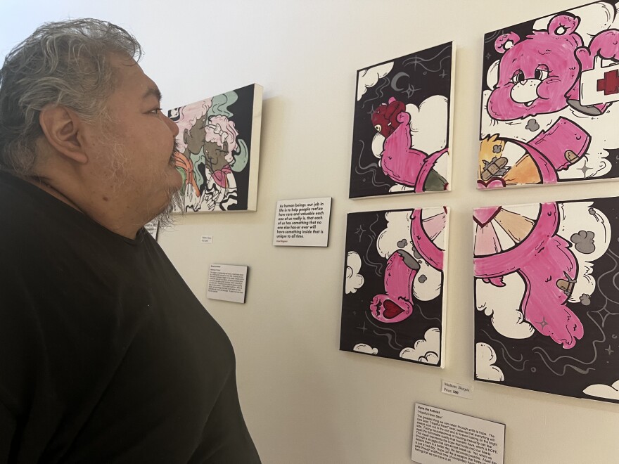 Eldon Dotomain enjoying Ryna Lealai's art at the opening of the Meaning of Home exhibit at the Brother Francis Shelter. September 2nd, 2023.