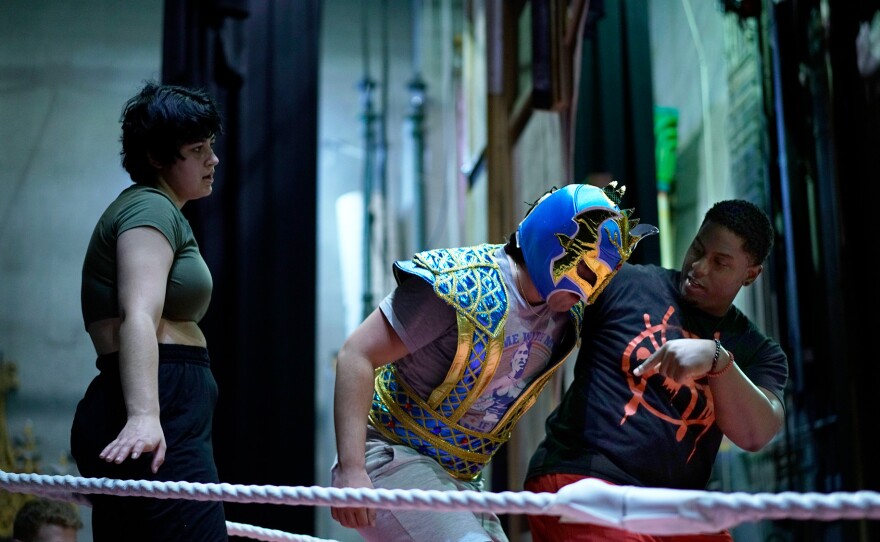 Brandon Riley teaches Max Contreras and Joseph Quick how to move in a Lucha Libre fight scene. Brandon reminds them to communicate what would happen before making any movement. Columbia, MO. March 07, 2023