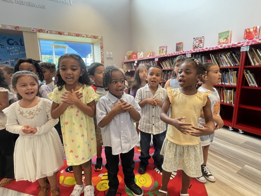 Children in the voluntary pre-K program at the Guadalupe Center sing at All in for Early Education Day.