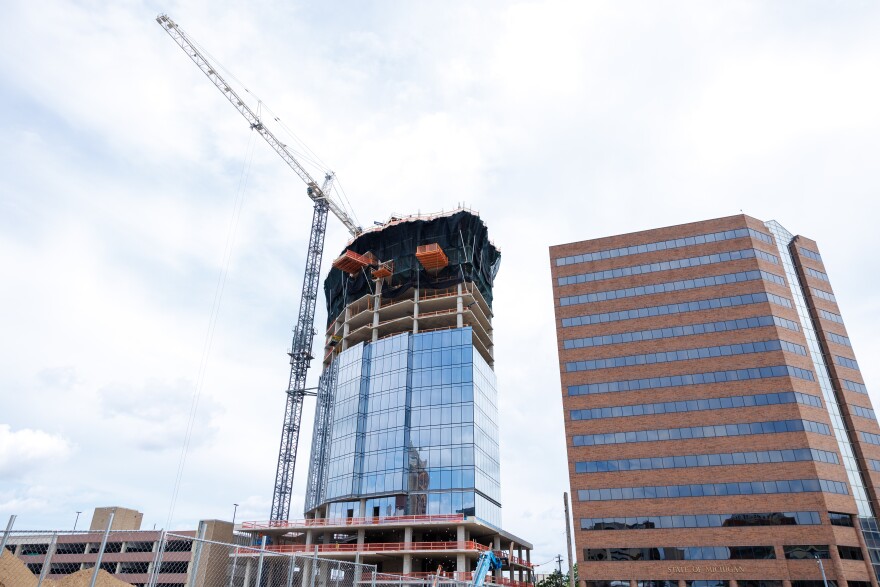 Construction of the Tower on Grand housing development in Lansing, Mich., is seen on Aug. 18, 2026. It will become the tallest building in the city once work is complete. The development is one of five included in the New Vision Lansing project.