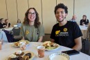 Vegan Outreach volunteers Autumn Gwinn (left) and Austin Simmons (right) enjoy the 2023 winning meal of the Vegan Chef Challenge