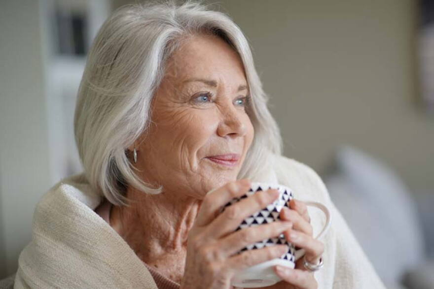 Older woman with coffee cup 