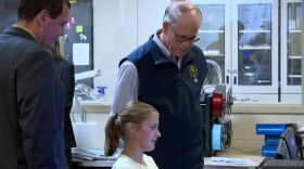 Indiana governor Mike Braun and Bloomfield schools superintendent Scott Van Der Aa watch as a Bloomfield High School student shows classwork on a computer Monday in Bloomfield.
