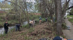 Volunteers in northern California work to clean up an area next to Yreka Creek.