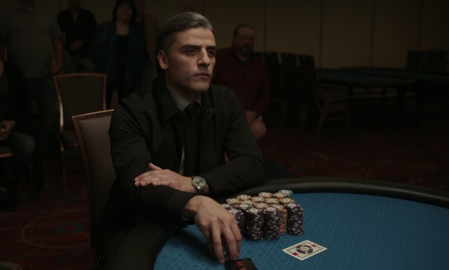Oscar Isaac plays a former military interrogator who is haunted by the past in <em>The Card Counter.</em>