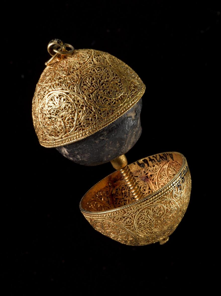 A bezoar, encased in a gold filigree shell, is a "stone" of indigestible mass formed in the guts of animals. They were once believed to be antidotes to poison — and play that role in the Harry Potter universe.