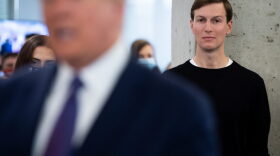 White House Senior Advisor Jared Kushner listens as US President Donald Trump visits his campaign headquarters in Arlington, Virginia.