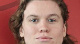 A young man poses for a headshot