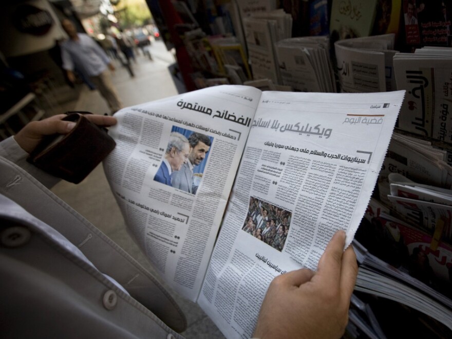 A man reads Lebanon's daily <em>Al-Akhbar</em> in Beirut. The paper is known for being close to Syria, but the regime's recent crackdown on dissenters — and lack of credible information about the protests — has strained that connection.