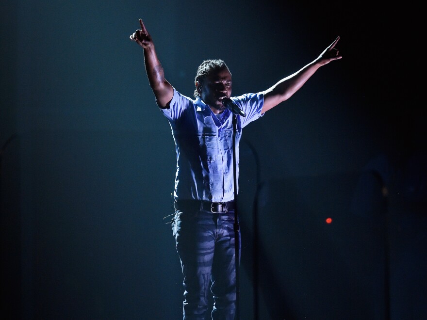 Rapper Kendrick Lamar performs onstage during the 58th Grammy Awards.
