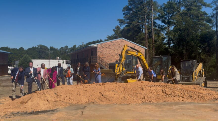 Homeless No More President and CEO Lila Anna Sauls, representatives from United Way of the Midlands and the South Carolina State Housing Finance and Development Authority, and other community leaders break ground at Grand Village in Columbia on Oct. 13.