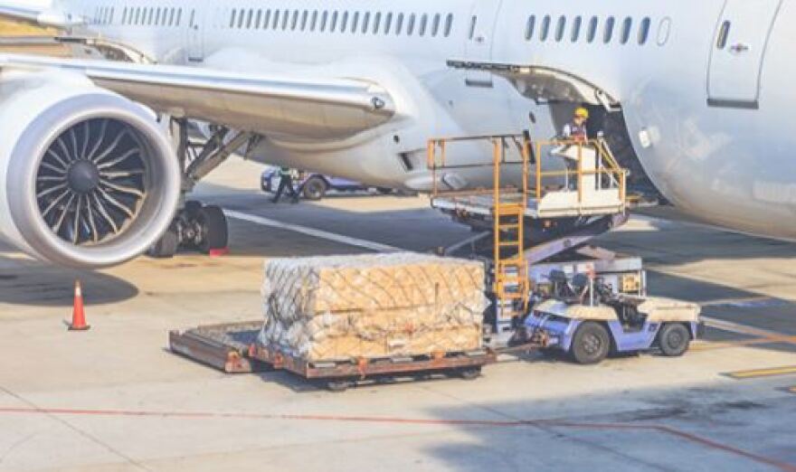 photo of plane being unloaded