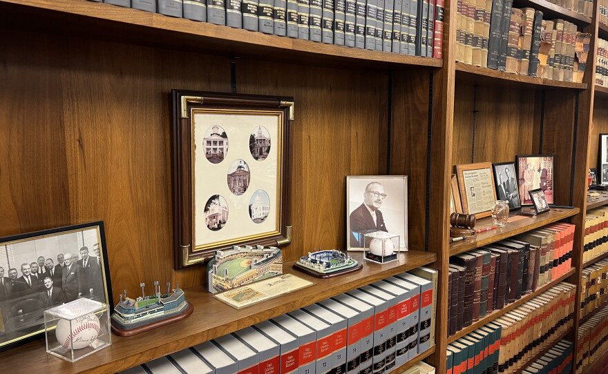 U.S. District Court Judge Walter Rice's bookshelves up-close with photos and mini baseball field sculptures