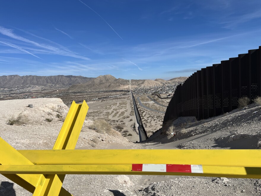 A thirty foot wall divides a rugged stretch of border between the U.S. and Mexico near El Paso, Texas.