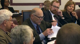 The Water Infrastructure Task Force makes last-minute changes to its report before finalizing it on Tuesday.