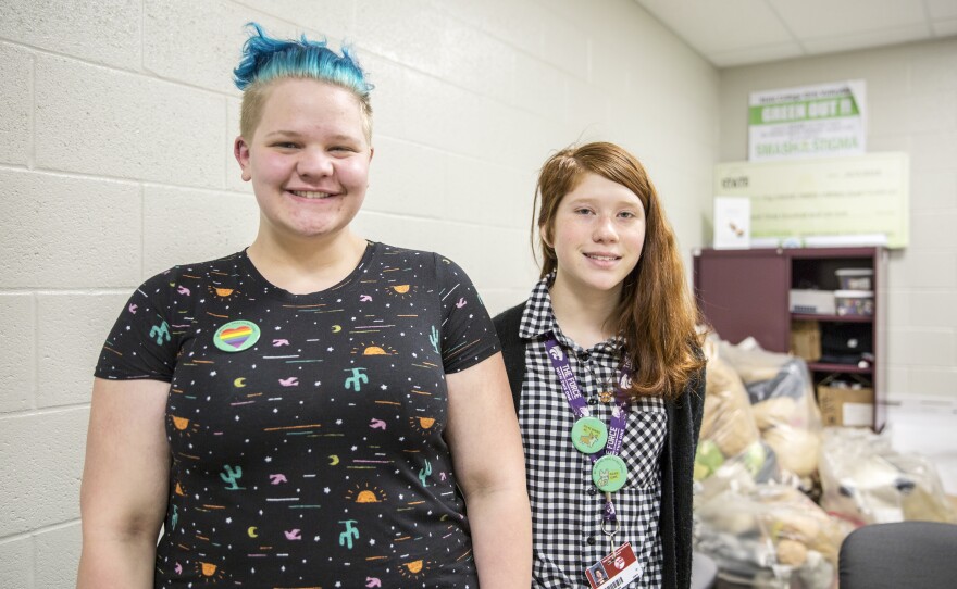 Jessica Griel, left, and Hailey Steele are both members of the "My Mental Health Matters" club. They wear green buttons that aim to spread awareness about mental health at State High.
