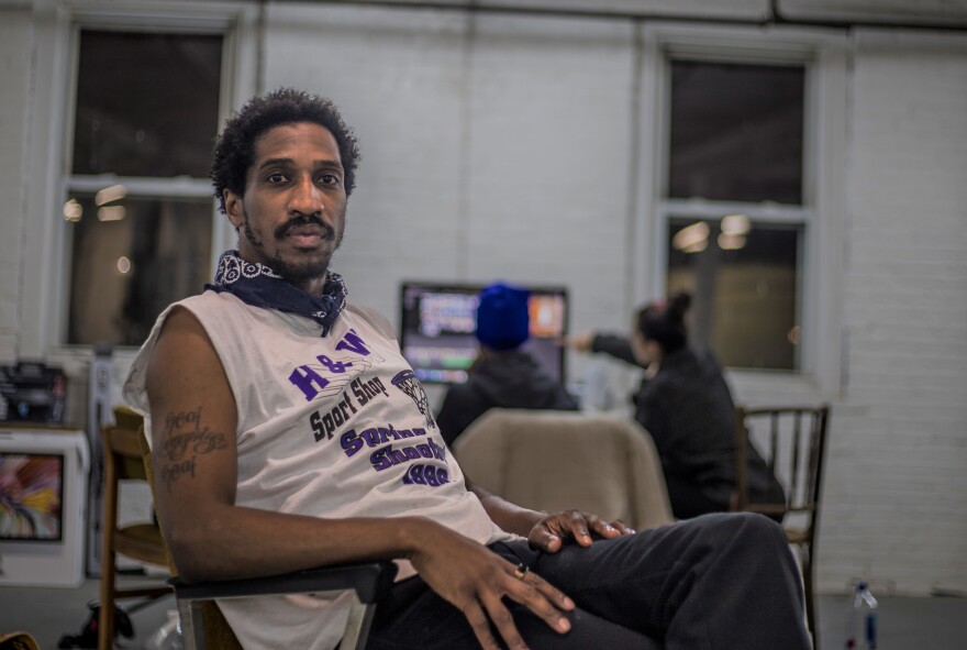 Jerald Cooper sits in his studio in the West End. Cooper started a popular Instagram account dedicated to architecture and black culture.