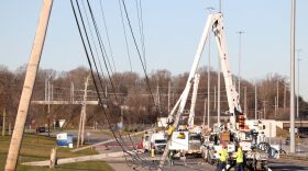 Crews from Ferguson Electric working along E. River Road Sunday near Mt. Hope Ave. on power restoration
