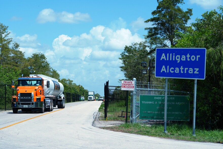 FILE - Trucks come and go from the "Alligator Alcatraz" immigration detention center in the Florida Everglades, Aug. 28, 2025, in Collier County, Fla. (AP Photo/Rebecca Blackwell, File)