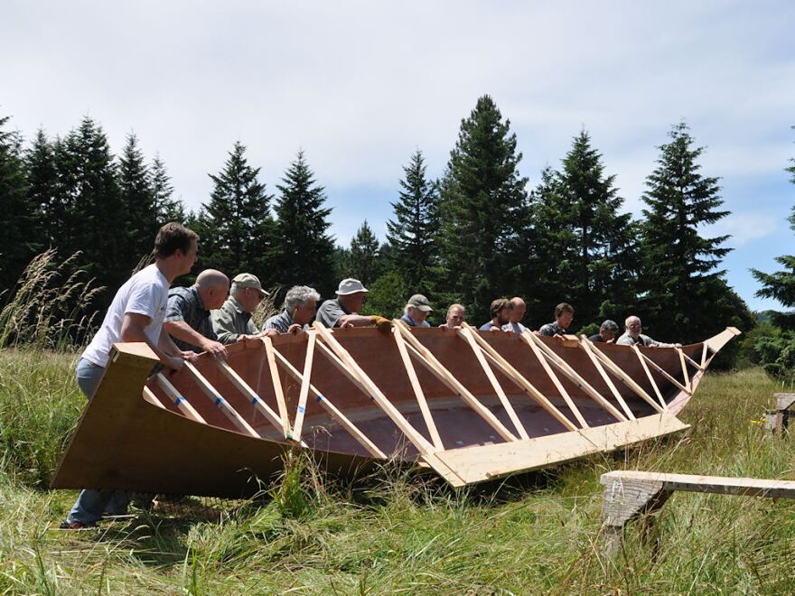 It took a dozen men to lift the Chinook canoe at the boat builder's shop earlier this year. The canoe will replace the one stolen by William Clark during the Lewis and Clark Expedition.