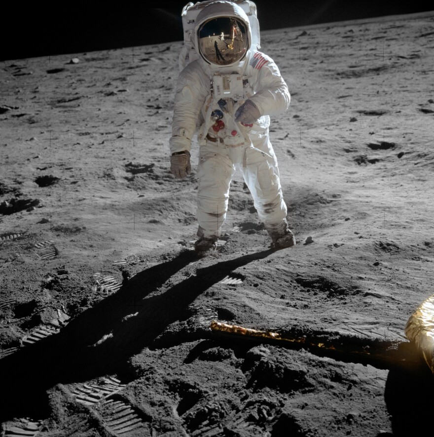 Astronaut Buzz Aldrin, lunar module pilot, stands on the surface of the moon near the leg of the lunar module, Eagle, during the Apollo 11 moonwalk. Astronaut Neil Armstrong, mission commander, took this photograph with a 70mm lunar surface camera.