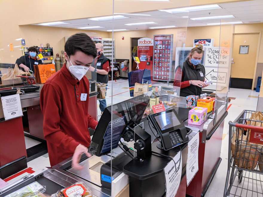 Grocery store clerk with mask