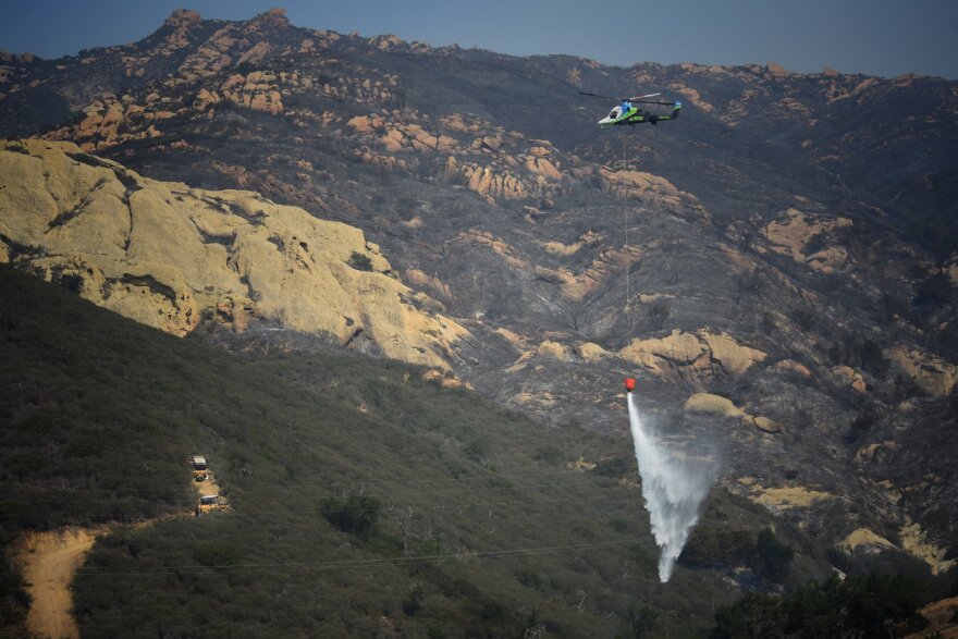 A helicopter drop on the Alisal fire Thursday afternoon.