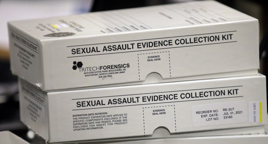 Two small white boxes marked "sexual assault evidence collection kit."