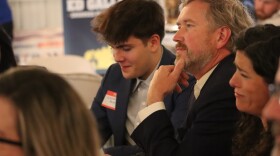 U.S. House Rep. Thomas Massie, who currently represents the northern Kentucky district, listens as his Trump-backed challenger Ed Gallrein attack his record at a GOP annual dinner in Pendleton County on Saturday.