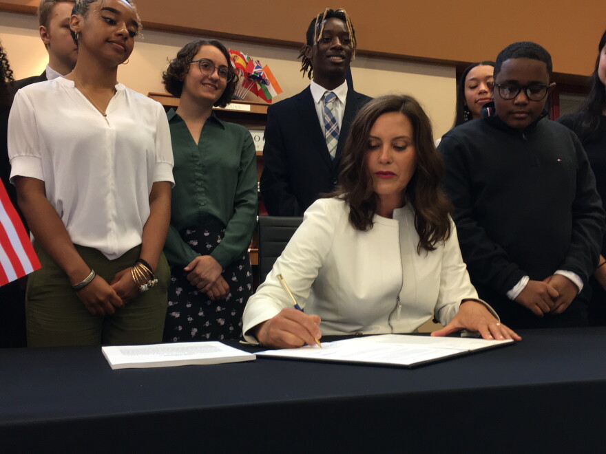 Governor Gretchen Whitmer signs the education funding bill at East Kentwood High School.