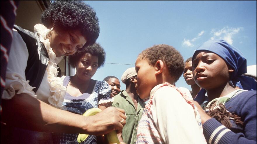 Winnie Madikizela-Mandela returns to the town of Brandfort, where she had been banished by the white government for nine years, to visit local children in 1986.