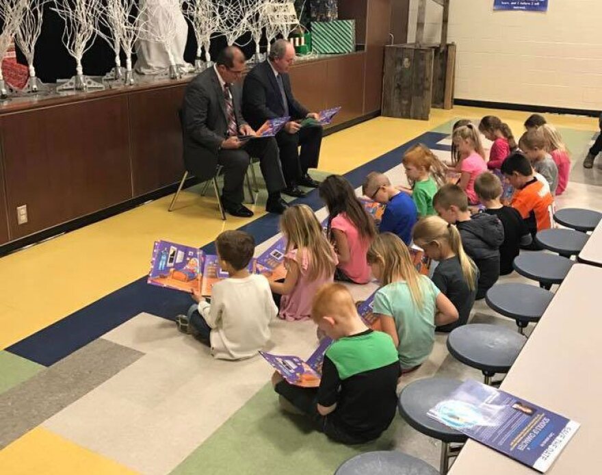 State Rep. Tom Gann and State Sen. Marty Quinn read aloud to first graders at Jefferson Elementary School in Pryor, Oklahoma.