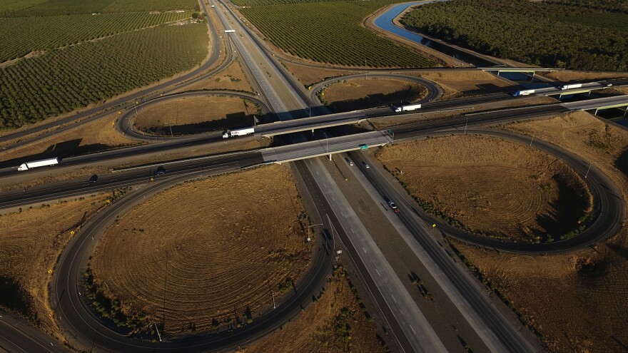 FILE - Freight trucks travel northbound on Interstate 5 Highway, Sept. 3, 2025, in Tracy, Calif.