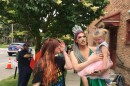 A drag queen holds a small child as part of a protest in Delaware, Ohio on June 5, 2019