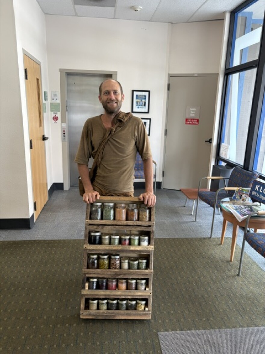 Robin Greenfield with recently foraged foods.
