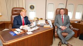 two men in office chairs