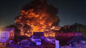 A large grass fire burns 10 acres in the small, unincorporated town of Sand Branch, which doesn't have running water.