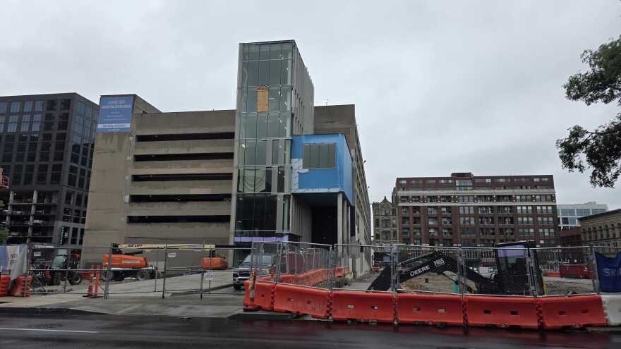 The Whex Garage (left) will be renamed the Convention Center Garage when renovations are complete in mid-June. The adjacent empty lot is the site of the future convention hotel.
