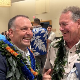 Hawaiʻi Gov. Josh Green, left, speaks with U.S. Rep. Ed Case at the Democratic Party's post-primary election unity breakfast on Sunday, Aug. 9, 2026.