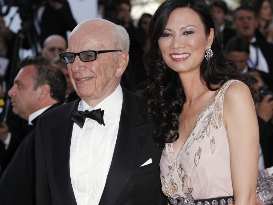 Media magnate Rupert Murdoch, left, and his wife Wendi Deng Murdoch arrive for the screening of <em>The Tree of Life</em> at the 64th international film festival, in Cannes, southern France on May 16. Rupert Murdoch has come under fire recently as reports come to light that employees of some of his news organizations hacked into cell phones to get story leads.