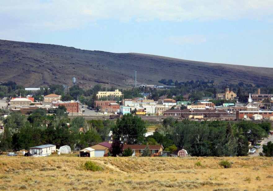 Row of buildings and trees in the distance.