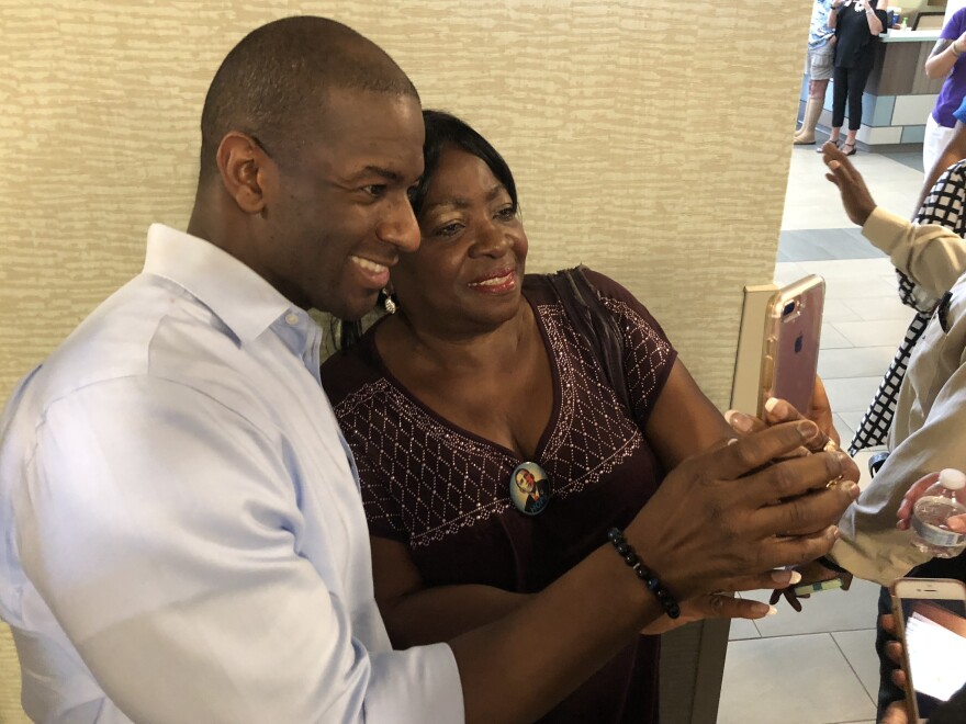 Andrew Gillum, the Democratic nominee for governor of Florida, takes a selfie with Dorothy Himmelstein after a campaign event in Flagler County.